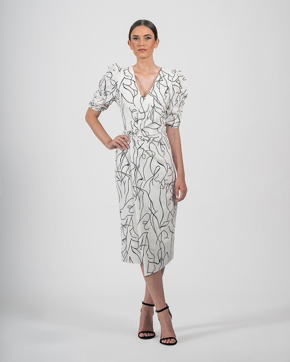 Vestido midi recto estampado y cruzado con manga gigot