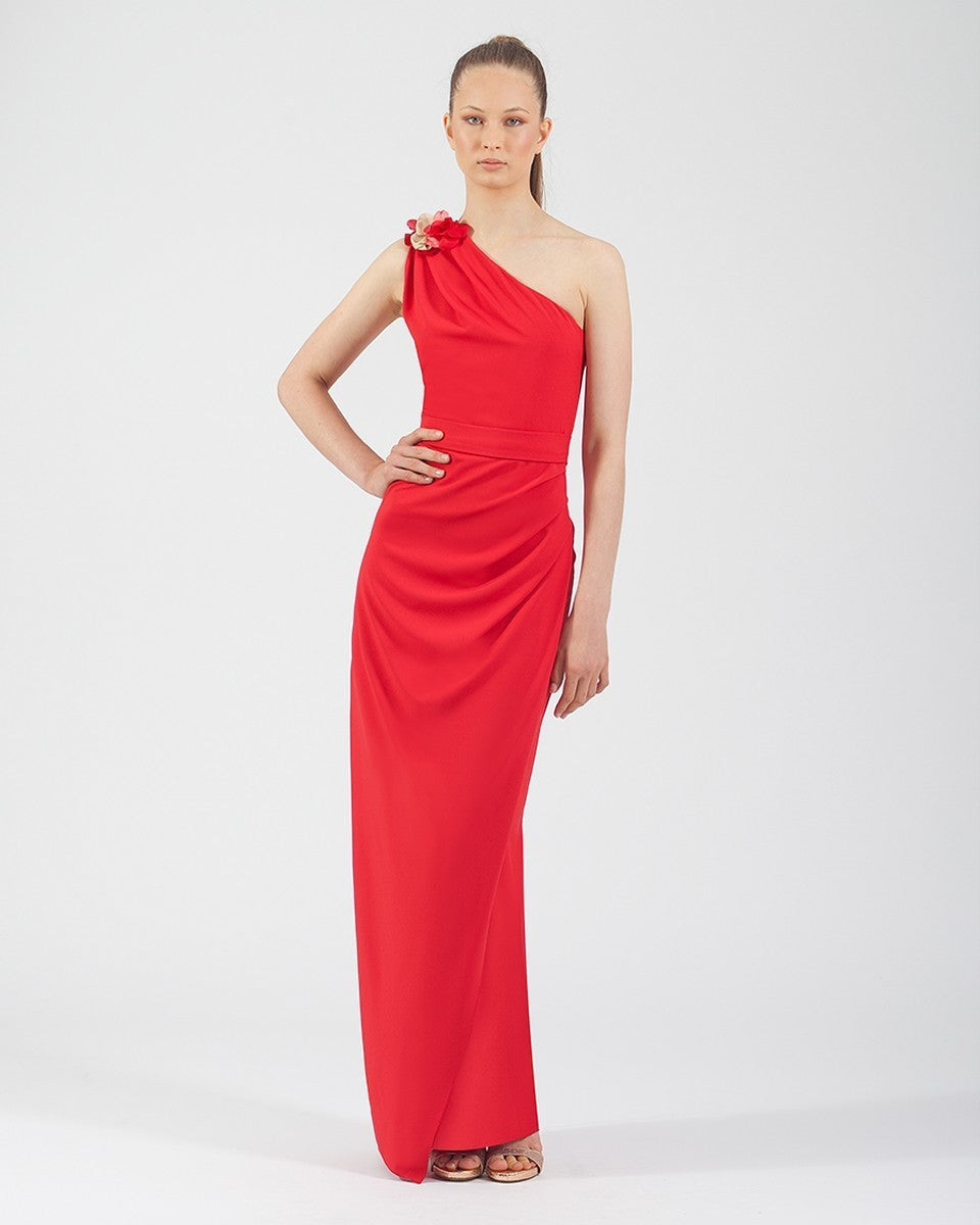 Long straight crepe dress with asymmetrical neckline and flower on the shoulder 